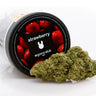 tarro de flores de CBD genética strawberry, decorado con fresas, con flor de CBD delante 