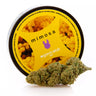 Flores de  genética MIMOSA de CBD  junto con su envase en fondo blanco 
